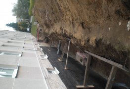 Řešení odvlhčení a sanace vlhkého zdiva většího bytového domu.